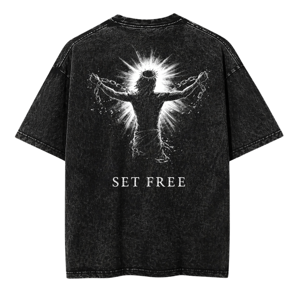 Black t-shirt with a graphic design and 'SET FREE' text on a white background